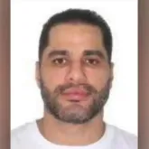 Sic�rio: o homem da foto com Fl�vio Bolsonaro que morreu na pris�o