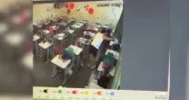 Professora � demitida ap�s flagrar esmagando prova no rosto de aluno