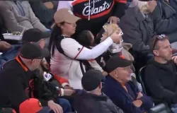 M�e vira alvo de cr�ticas ap�s v�deo em jogo de beisebol, mas defende marido