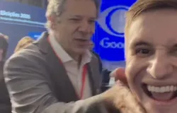 Haddad reage a provoca��es com tapas e brinca que foi 'carinho' em debate