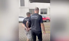 Pol�cia prende suspeito de fornecer fuzis para a Rocinha