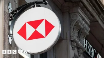 Logotipo da HSBC no lado de um pr�dio no Reino Unido. S�o quatro tri�ngulos vermelhos dentro de um c�rculo branco.