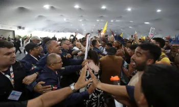 Demonstrators, including Indigenous people, take part in a protest as they force their way into the venue hosting the UN Climate Change Conference (COP30), in Belem, Brazil, November 11, 2025. REUTERS/Anderson Coelho