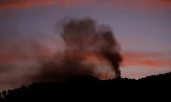 Smoke rises near Fort Tiuna, after U.S. President Donald Trump said the U.S. has struck Venezuela and captured its President Nicolas Maduro, in Caracas, Venezuela, January 3, 2026.  REUTERS/Leonardo Fernandez Viloria