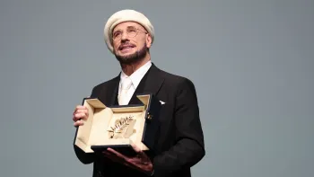 John Travolta recebe Palma de Ouro honor�ria no palco do 79� Festival de Cinema de Cannes Aurore Marechal/Getty Images