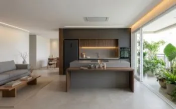 Cozinha integrada com design silencioso, eletrodom�sticos embutidos e revestimentos cont�nuos