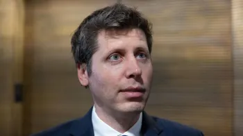 Image caption, OpenAI chief Sam Altman answering questions in a hallway during a trip to Washington DC.